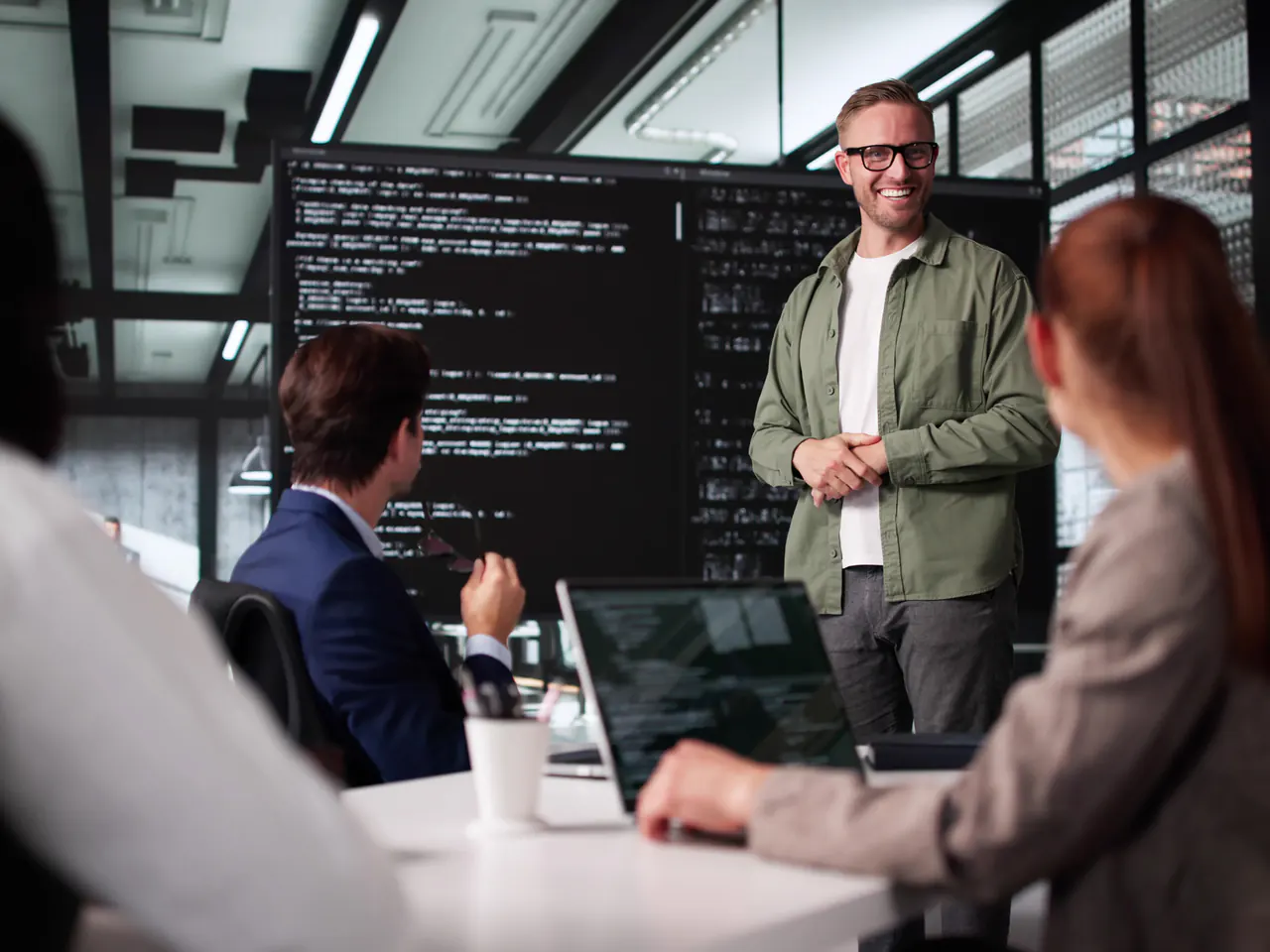 A technology specialist supporting a delivery team during a focused implementation workstream discussion.